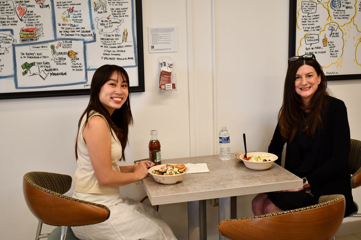 student and her mentor at lunch