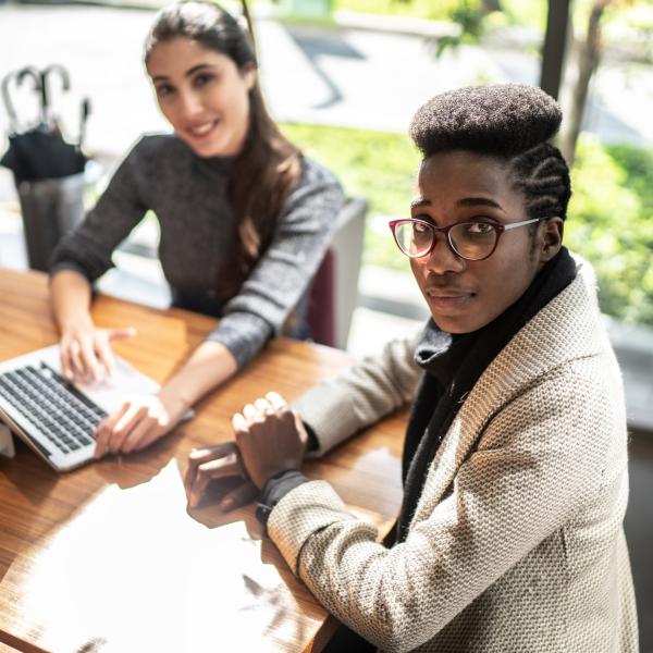 women at a table working together