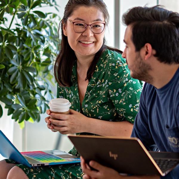 Students with laptops and coffee