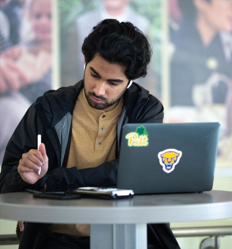 student studying in commons