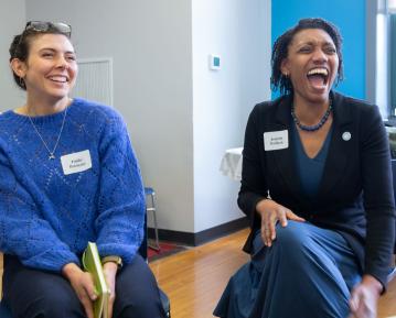 Two people laughing