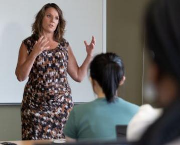 Faculty lecturing in front of class