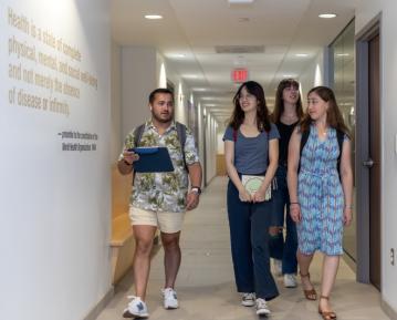 students talking at Pitt Public Health