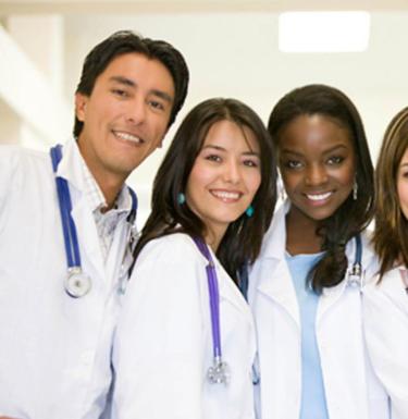 Students Smiling in lab coats