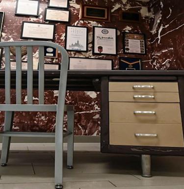 Salk's desk and framed accolades