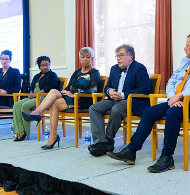 panelists at the frontlines of public health symposium