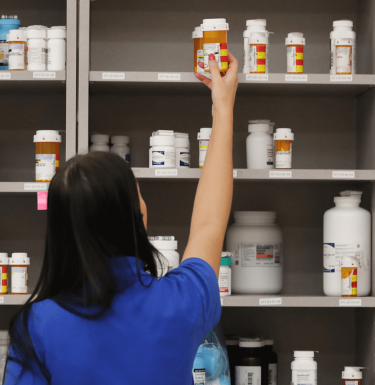 pharmacist holding prescription 