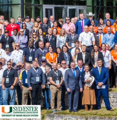 crop of group photo showing gresser and sylvester logo