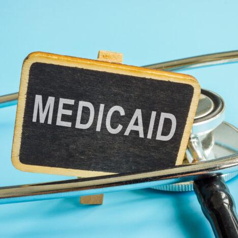 stock photo of sign with the words medicaid on it.