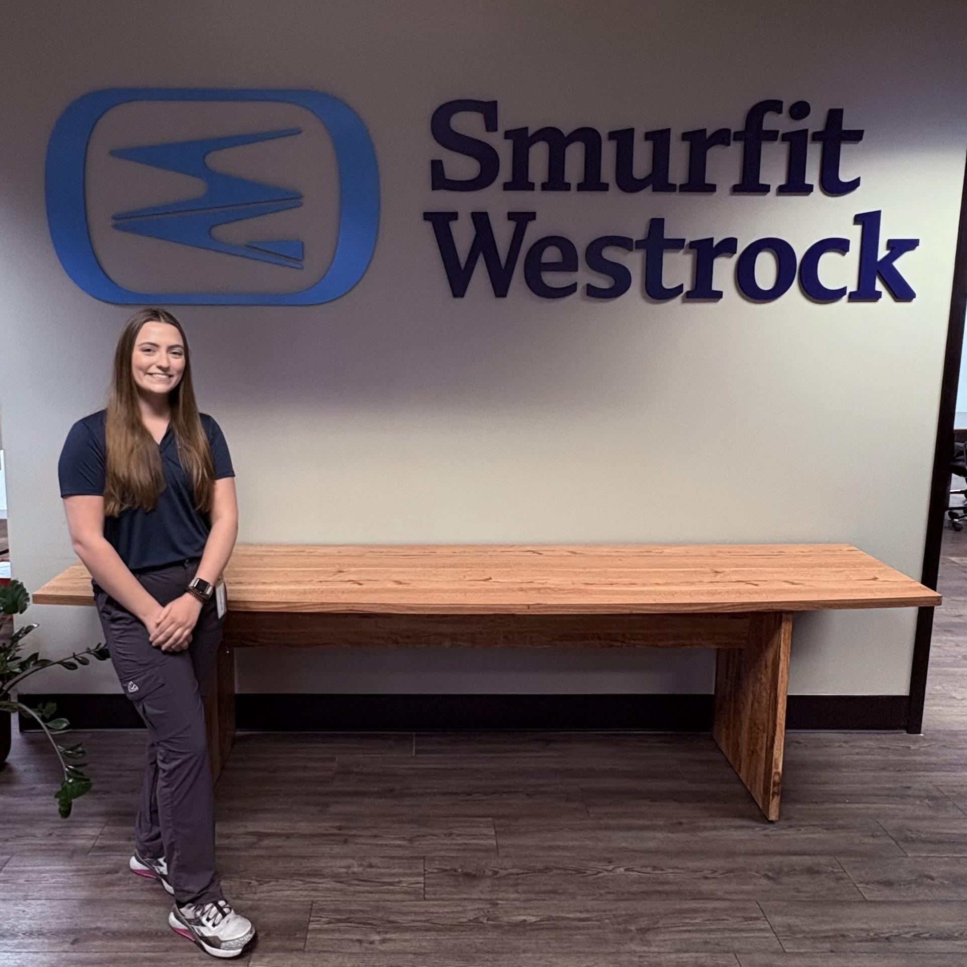 Liz on site with Smurfit Westrock on the wall behind her