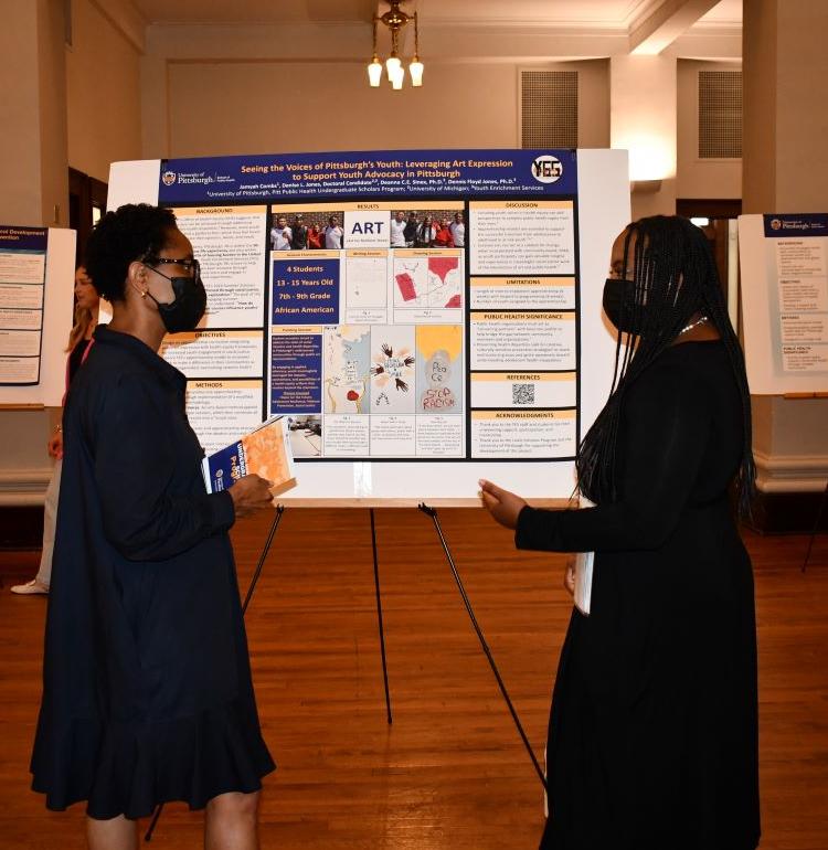 Terri and student at poster showcase