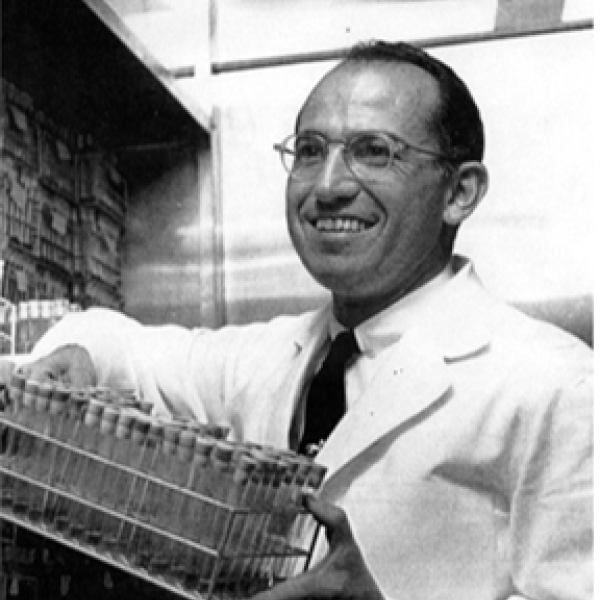 Jonas Salk smiling in lab